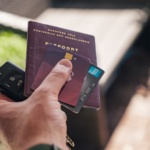 person holding black and brown book