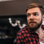 man in red and black plaid top