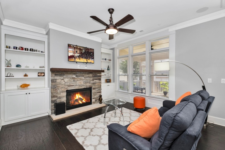 black leather sofa chair near fireplace