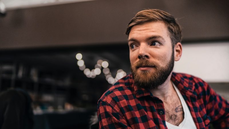 man in red and black plaid top